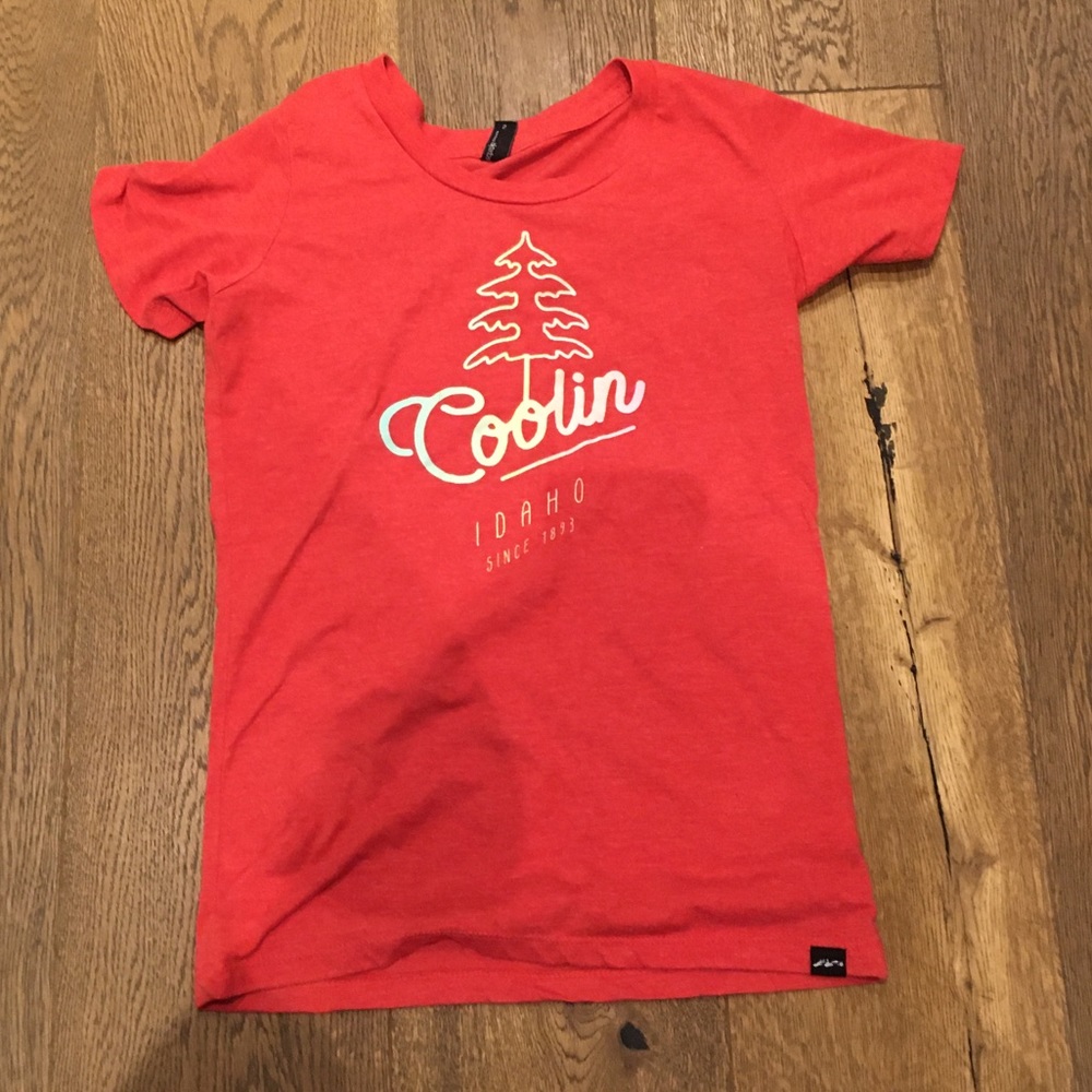 Red techstyles size small that says “Coolin Idaho sense 1893